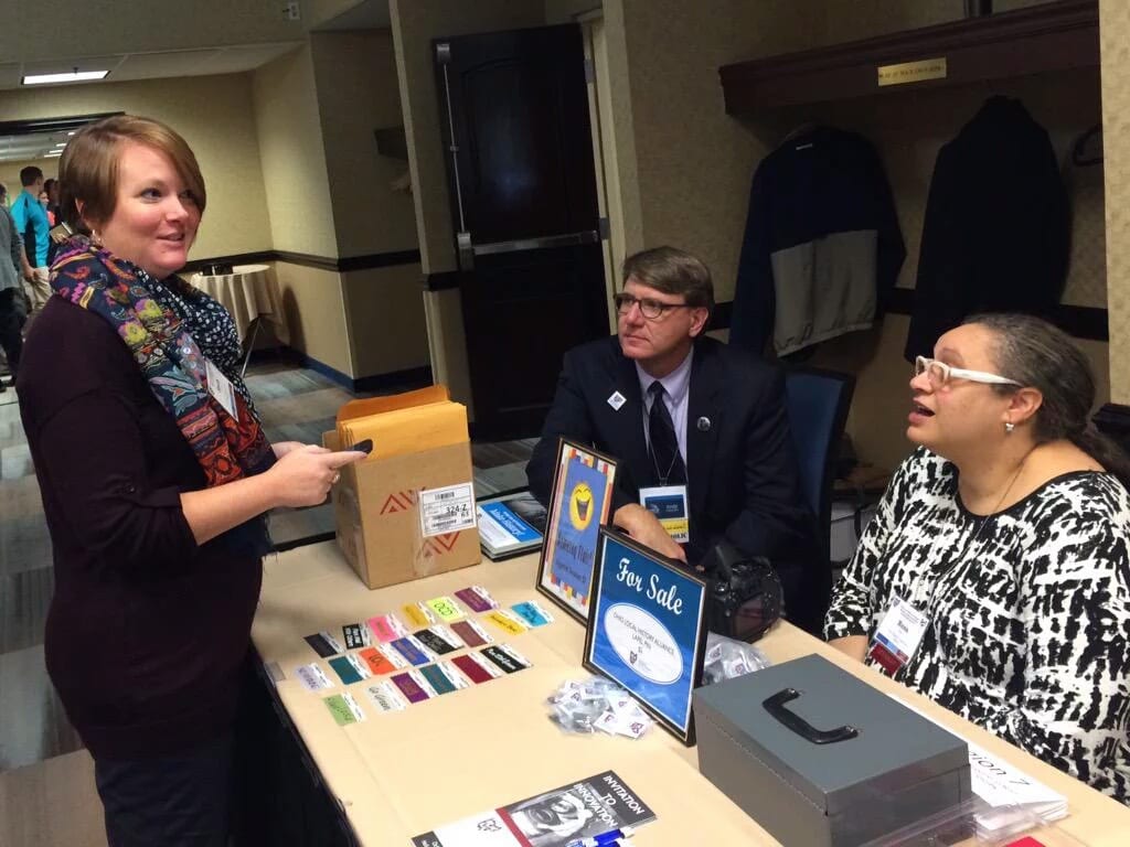 Ruth Brindle, Andy Verhoff, and Rosa Rojas at registration table before Awards Luncheon, 2015